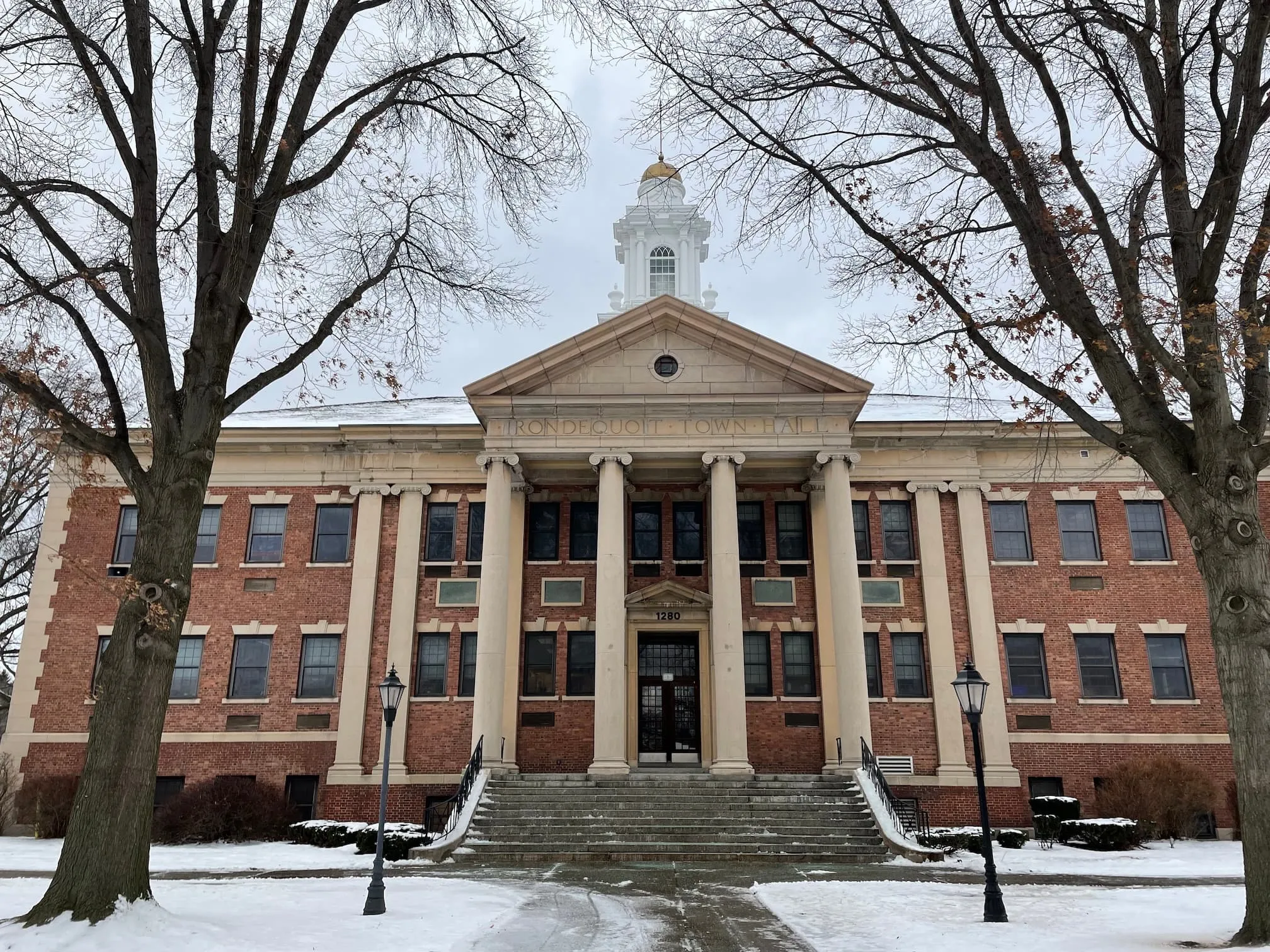 The regal front pillars of the Irondequoit Town Hall, with snow on the ground
